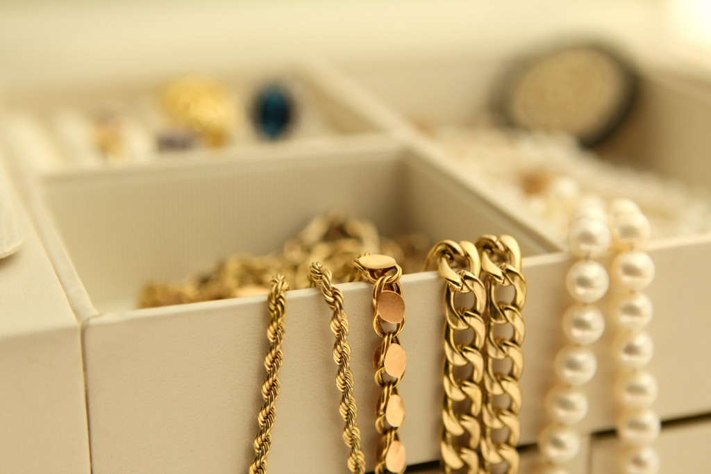 Gold jewelry and pearls in a box Copy Space