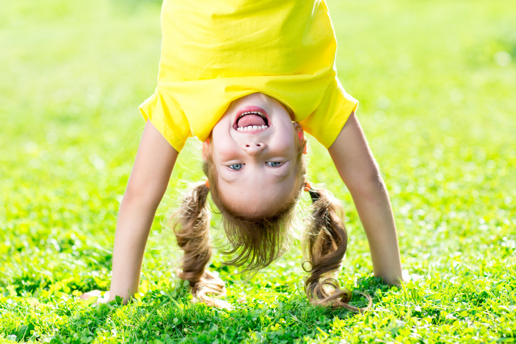 Little girl performing gymnastics
