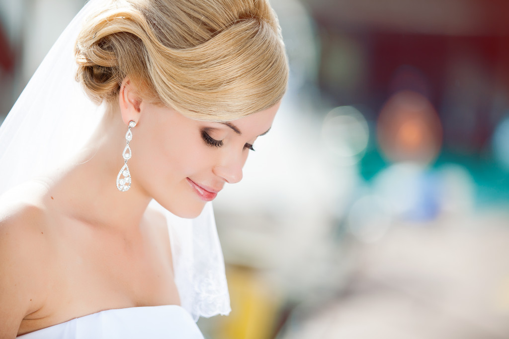 a bride with drop earrings