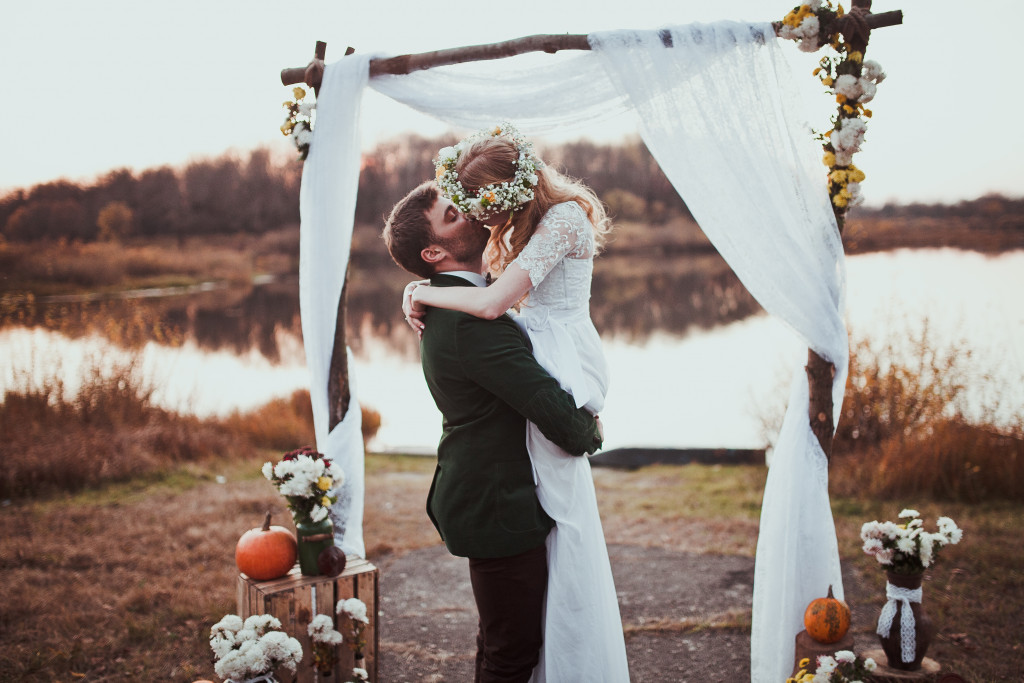 a barn farm wedding with bride and groom kissing