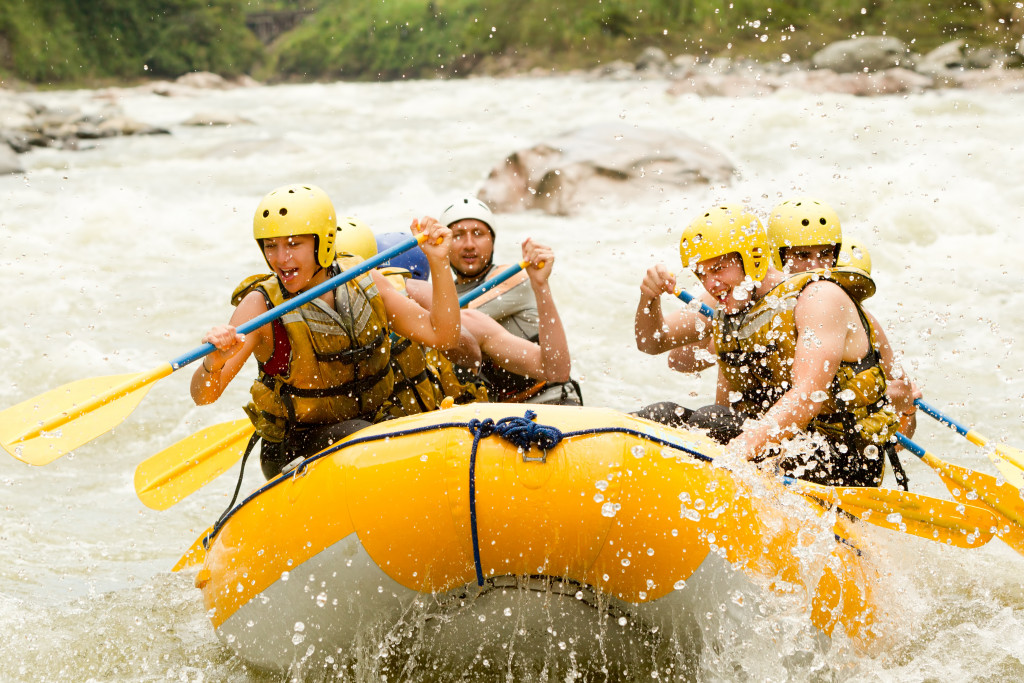 A group of friends whitewater rafting